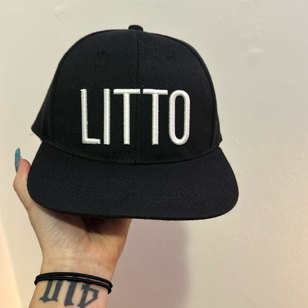 Black snap back. Brand new, never worn.